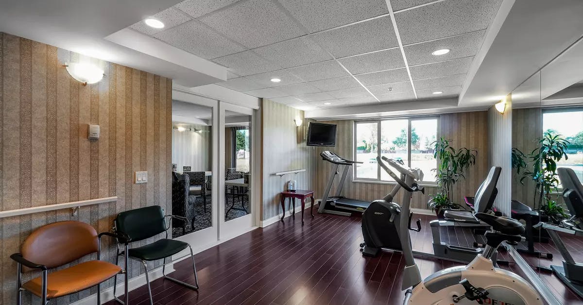 modern fitness facility at chartwell crescent gardens retirement residence