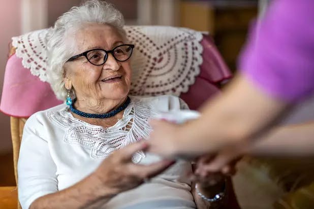 Chartwell Long Term Care senior resident reaching out to staff