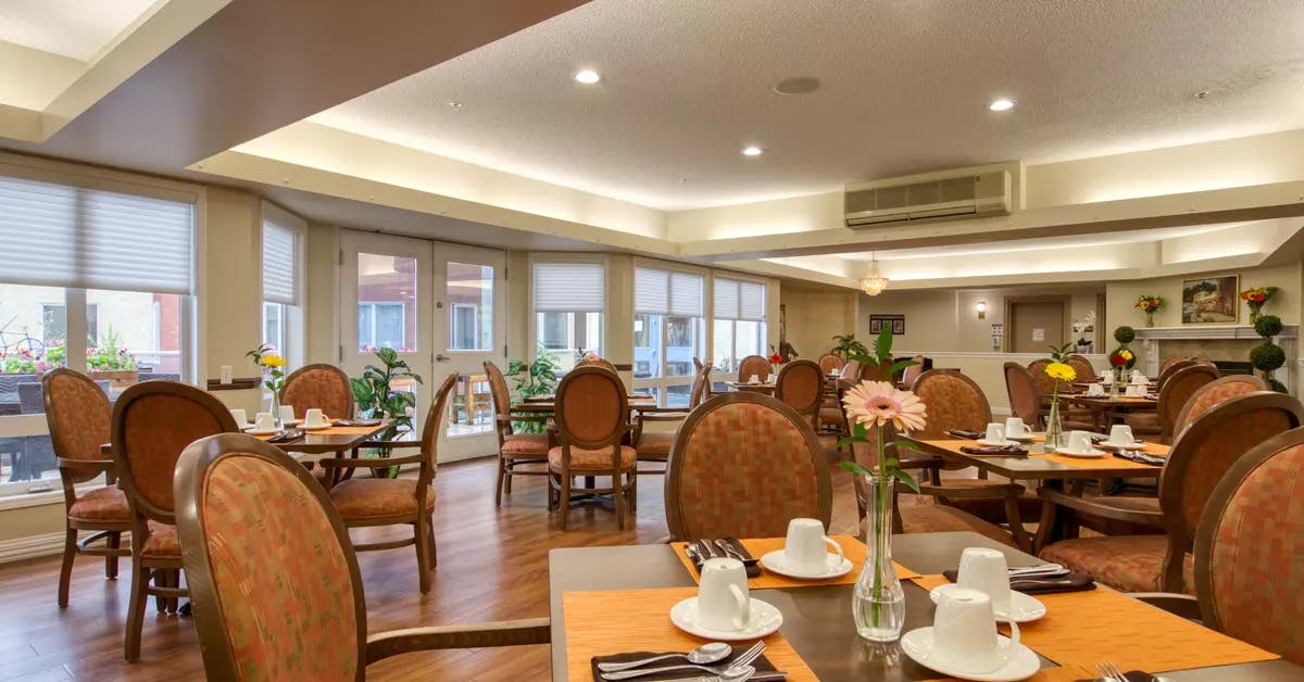 spacious dining room at chartwell royal park retirement residence