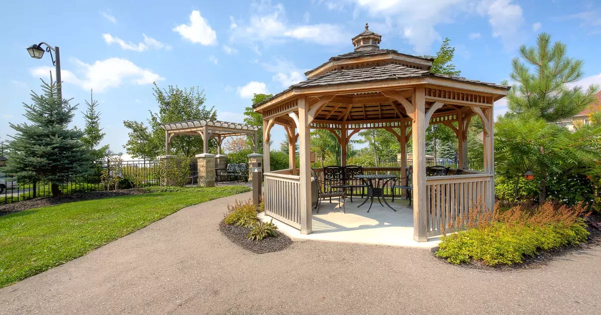 Gazebo and walking paths at Chartwell Hollandview Trail Retirement Residence.