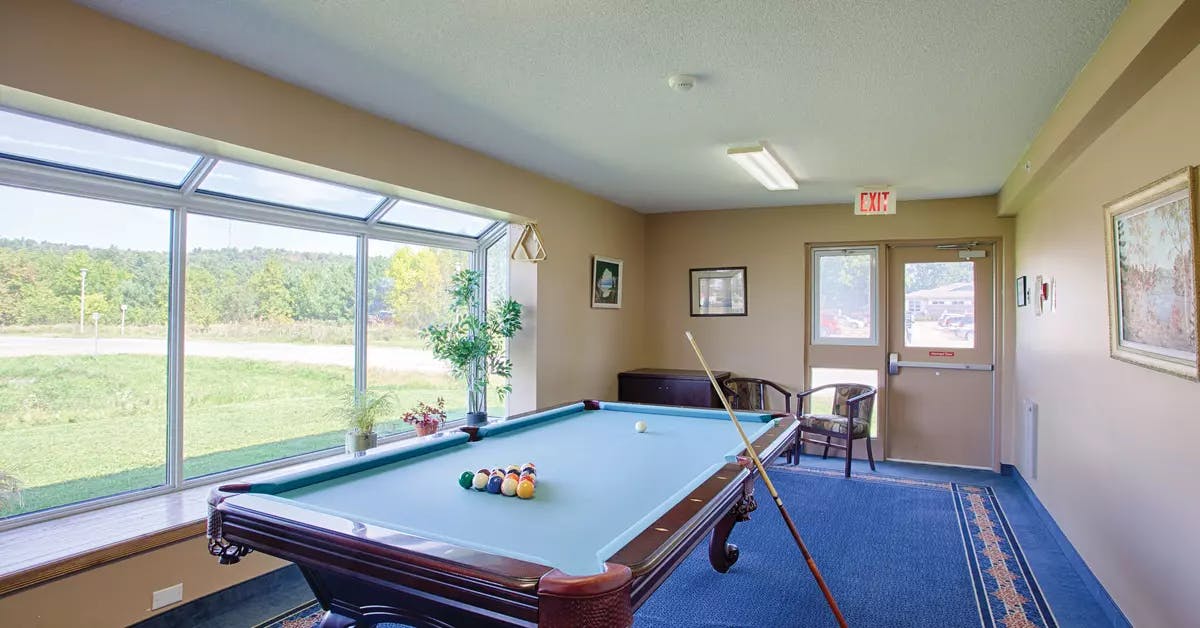 billiards room at chartwell quail creek retirement residence