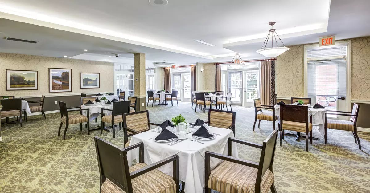 Open and bright dining room at Chartwell Orchards Retirement Residence
