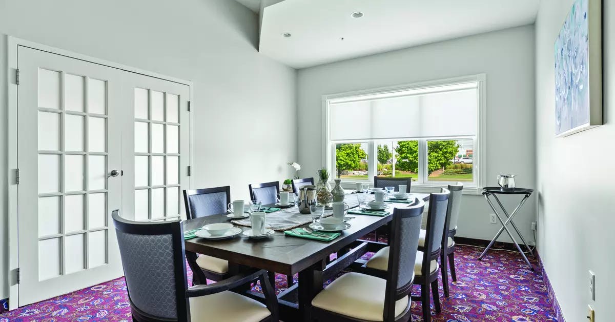 Bright and inviting private dining room at Chartwell Barton Retirement Residence.